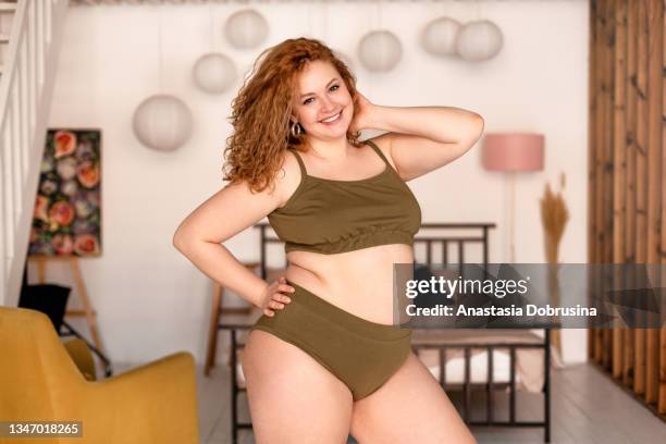 beautiful woman in underwear in bedroom. - fat redheads stock pictures, royalty-free photos & images