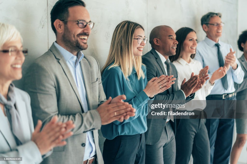 Business people applauding