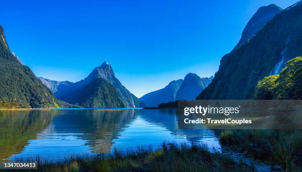 milford sound, new zealand. mitre peak is the iconic landmark of milford sound in fiordland national park, south island of new zealand. - mitre peak stock pictures, royalty-free photos & images