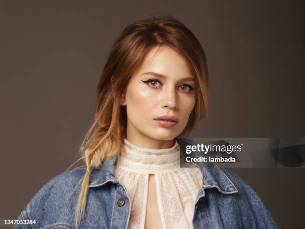 portrait of beautiful and stylish woman wearing denim jacket - eyeliner stock pictures, royalty-free photos & images