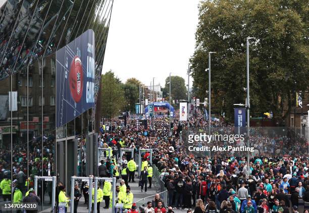 Fans arrive ahead of the NFL London 2021 match between Miami Dolphins and Jacksonville Jaguars at Tottenham Hotspur Stadium on October 17, 2021 in...