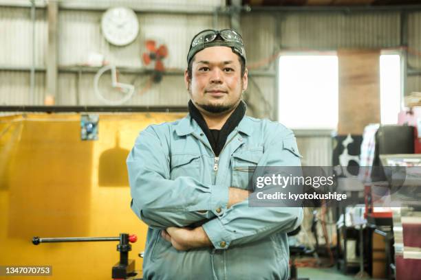 portrait of asian factory worker - technician workbench stock pictures, royalty-free photos & images