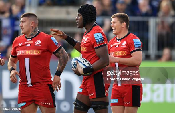 Maro Itoje of Saracens celebrates with team mates Marco Riccioni and Owen Farrell after scoring their first try during the Gallagher Premiership...