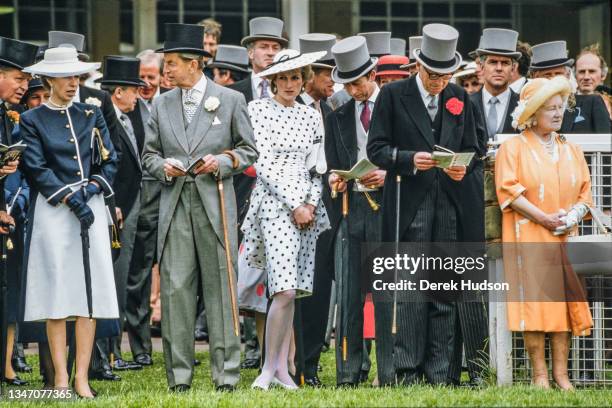 View of married couple Diana, Princess of Wales , in a black and white, polka-dot dress and a matching, wide-brimmed hat, and Charles, Prince of...