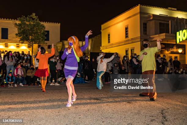 Actors dressed as Vilma Dinkley, Daphne Blake, Shaggy Rogers and Fred Jones performs in the Halloween parade at Warner Bros Park Madrid on October...