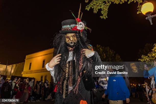 An actress disguised as a witch performs in the Halloween parade at Warner Bros Park Madrid on October 16, 2021 in Madrid, Spain.