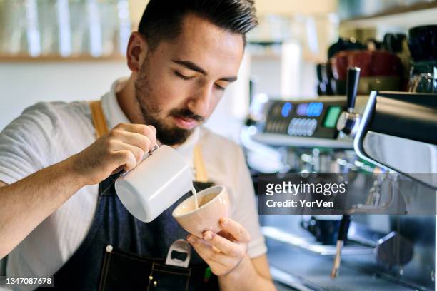 barista preparing coffee at coffee shop - coffee moustache stock pictures, royalty-free photos & images