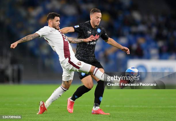 Antonio Sanabria of Torino FC battles for possession with Hubert Idasiak of SSC Napoli during the Serie A match between SSC Napoli and Torino FC at...