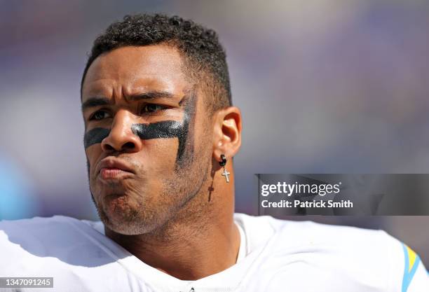 Christian Covington of the Los Angeles Chargers looks on during warm ups prior to the game against the Baltimore Ravens at M&T Bank Stadium on...