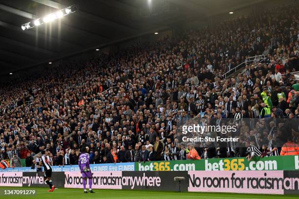 General view inside the stadium as the fans of Newcastle United explain to Isaac Hayden of Newcastle United and Tanguy Ndombele of Tottenham Hotspur...
