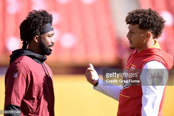 Kendall Fuller of the Washington Football Team and Patrick Mahomes of the Kansas City Chiefs have a conversation before the game at FedExField on...