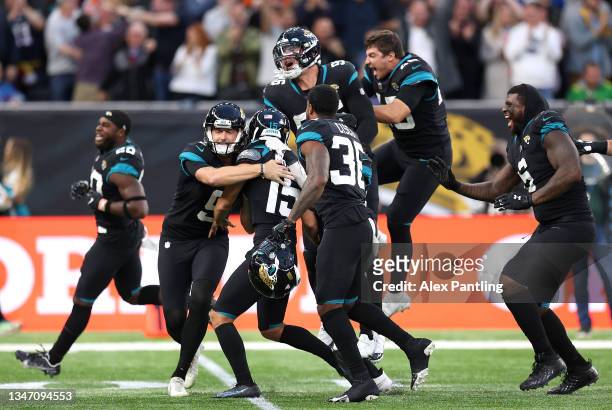 Matthew Wright of Jacksonville Jaguars celebrates with team mates after kicking the winning field goal during the NFL London 2021 match between Miami...