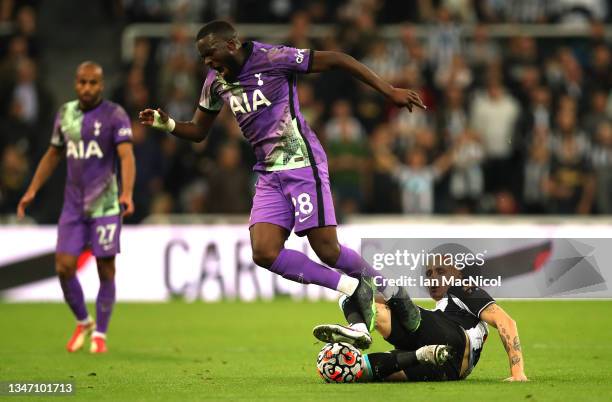 Jonjo Shelvey of Newcastle United fouls Tanguy Ndombele of Tottenham Hotspur, which leads to a red card during the Premier League match between...