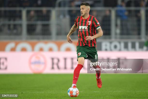 Jeffrey Gouweleeuw of FC Augsburg runs with the ball during the Bundesliga match between FC Augsburg and DSC Arminia Bielefeld at WWK-Arena on...