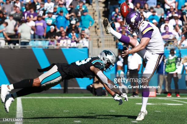 Frankie Luvu of the Carolina Panthers blocks the punt kick return by Jordan Berry of the Minnesota Vikings during the third quarter at Bank of...
