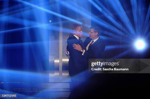 Thomas Gottschalk and Guenther Jauch hug after the 199th "Wetten dass...?" show at the Rothaus Hall on December 3, 2011 in Friedrichshafen, Germany....