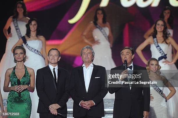 Sylvie Tellier, Francis Huster, Alain Delon and Jean-Pierre Foucault stand on stage during Miss France 2012 Beauty pageant on December 3, 2011 in...