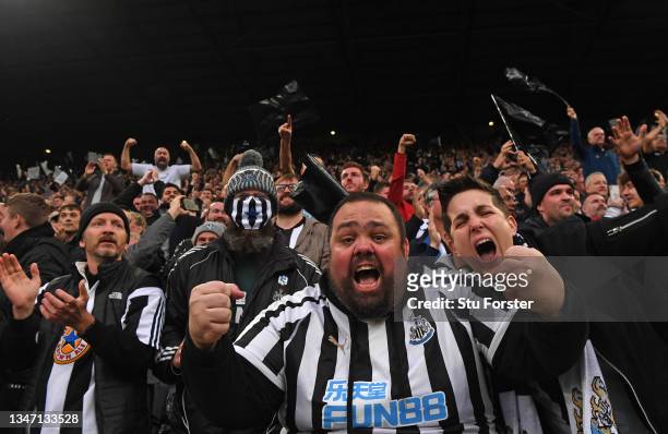 Newcastle fans in the Gallowgate End celebrate the opening goal scored by Callum Wilson during the Premier League match between Newcastle United and...