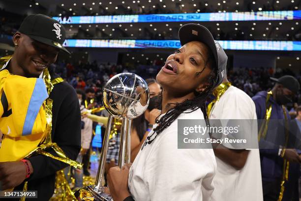 Diamond DeShields of the Chicago Sky celebrates with the championship trophy after defeating the Phoenix Mercury 80-74 in Game Four of the WNBA...