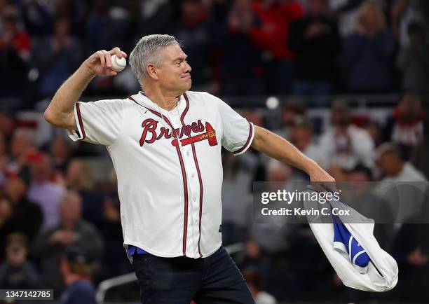Former Atlanta Braves player Dale Murphy throws out the ceremonial first pitch before the Braves play the Los Angeles Dodgers in Game Two of the...