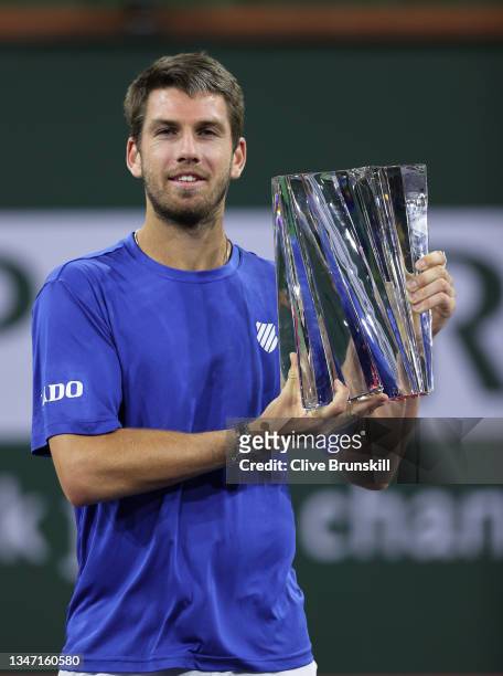 Cameron Norrie of Great Britain holds his winners trophy after his three set victory against Nikoloz Basilashvili of Georgia in the men's final match...