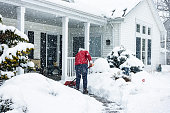 Red Jacket Woman Push Shoveling Winter Blizzard Snow