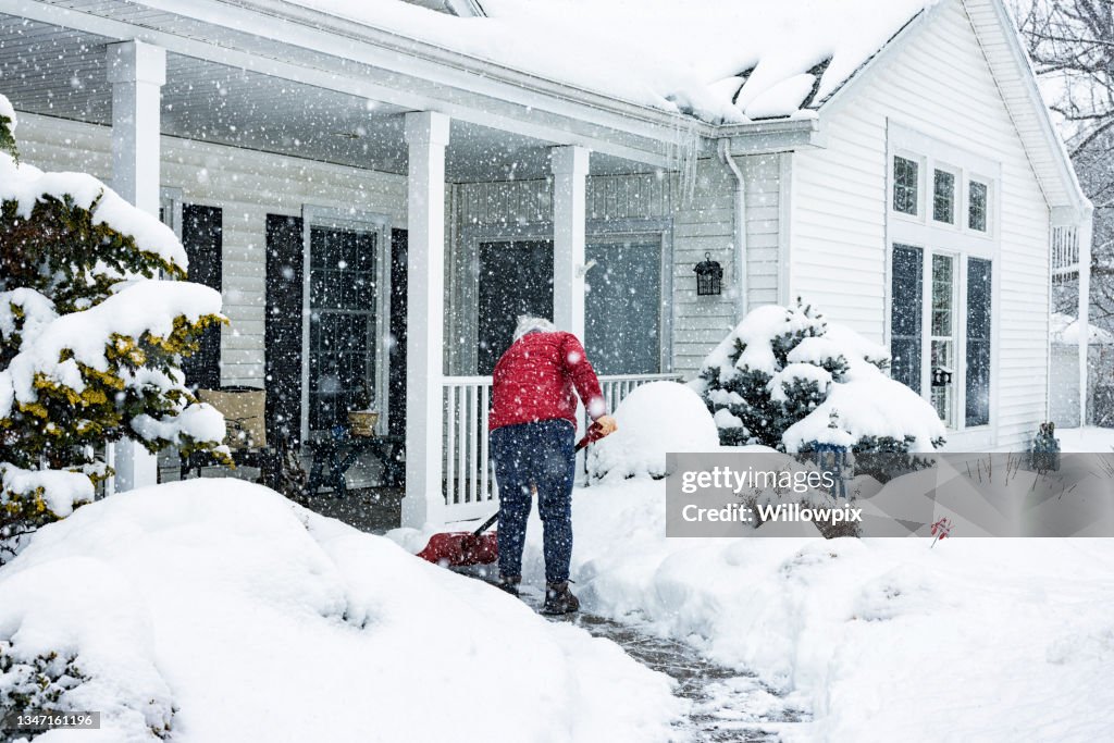 Red Jacket Woman Push Shoveling Winter Blizzard Snow