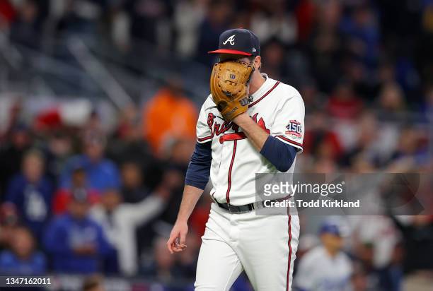 Luke Jackson of the Atlanta Braves reacts after he gave up a double to Chris Taylor of the Los Angeles Dodgers that scored two runs in the seventh...