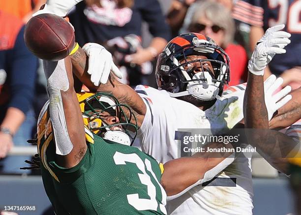 Adrian Amos of the Green Bay Packers breaks up a pass intended for Allen Robinson of the Chicago Bears at Soldier Field on October 17, 2021 in...