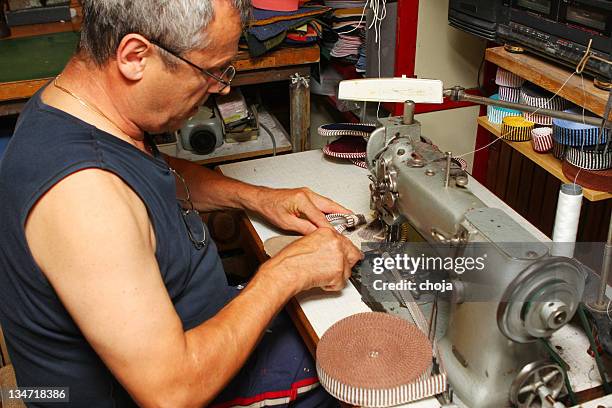 tailor in his workshop...working with sewing machine making cotton slippers - pinking shears stock pictures, royalty-free photos & images