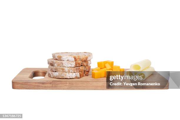 cutting board with cheese and bread isolated on white background - immagine on white board foto e immagini stock