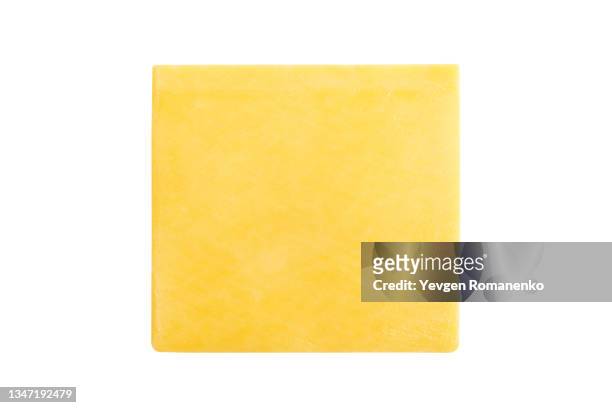 slice of cheese isolated on white background - scheibe portion stock-fotos und bilder