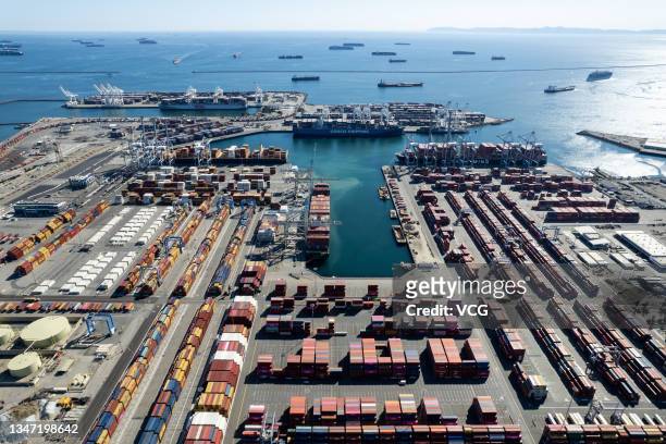 Aerial view of container ships waiting to enter and unload at Port of Long Beach on October 16, 2021 in Long Beach, California.