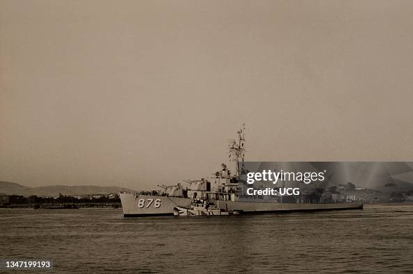 Tugboat guiding destroyer USS Rogers, anti submarine rocket launcher ...