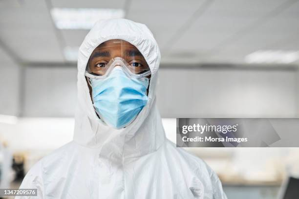 doctor in protective suit during covid-19 crisis - protective face mask bildbanksfoton och bilder