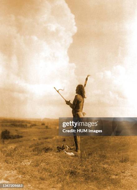 Edward S. Curits Native American Indians - Teton Sioux Indian performing vision cry ceremony through fasting and chanting to the Great Mystery circa...