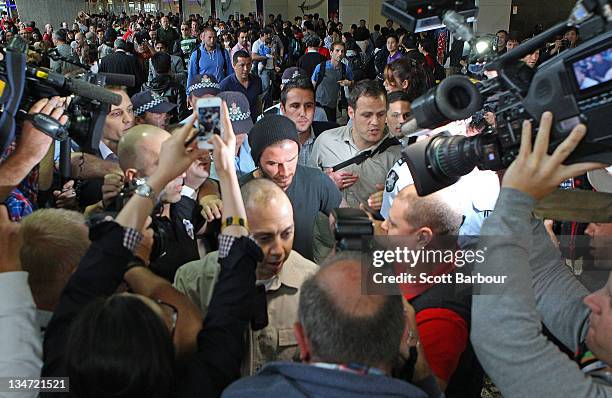 David Beckham is surrounded by the media as he arrives ahead of the LA Galaxy v Melbourne Victory Game at Melbourne Airport on December 4, 2011 in...