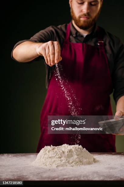 a pinch of salt to make the pizza better - dough-rising stock pictures, royalty-free photos & images