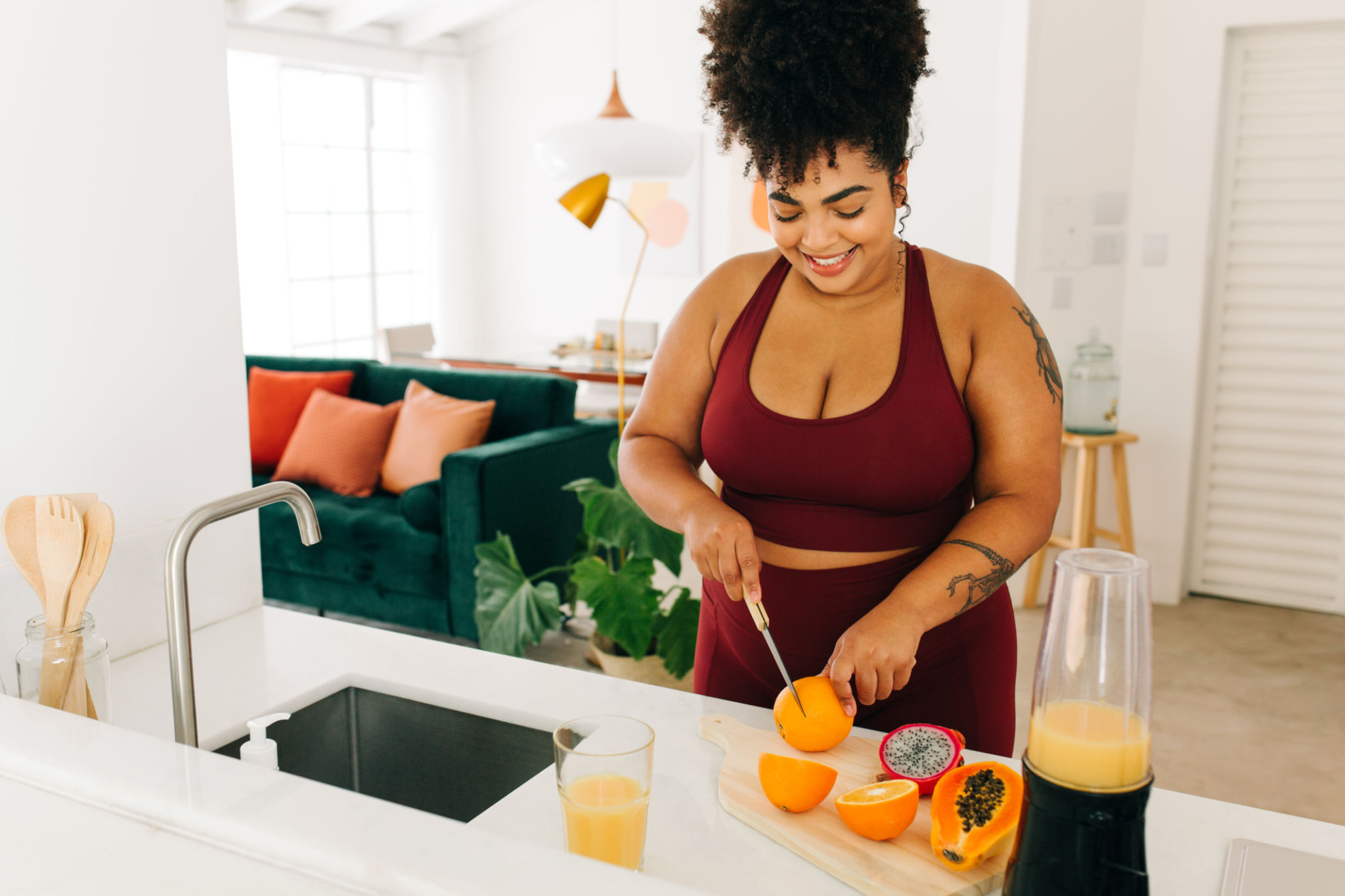 Fitness woman making juice at home Fitness woman making juice at home