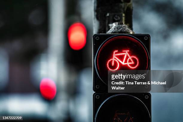 close up of red bicycle traffic light in road traffic. - stoplight bildbanksfoton och bilder