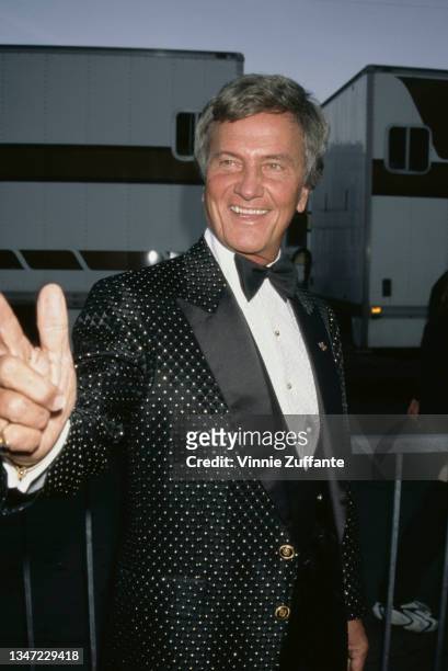 American singer, composer, and actor Pat Boone attends the 24th Annual American Music Awards at the Pasadena Civic Auditorium in Pasadena,...