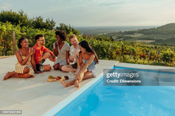 happy friends are having wine party at sunny day - pool party stock pictures, royalty-free photos & images