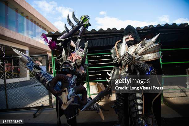 Anime and manga fans pose with costumes of their favourite characters during the fourth day of the SOFA 2021, a fair aimed to the geek audience in...