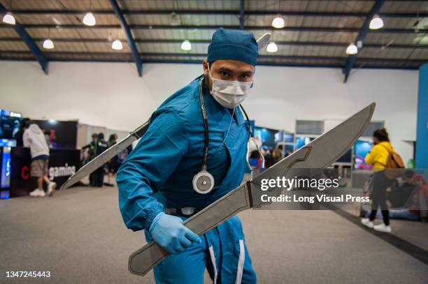 An attendee cosplays a doctor as an aim to showcase how medics are heroes too during the fourth day of the SOFA 2021, a fair in Colombia that mixes...