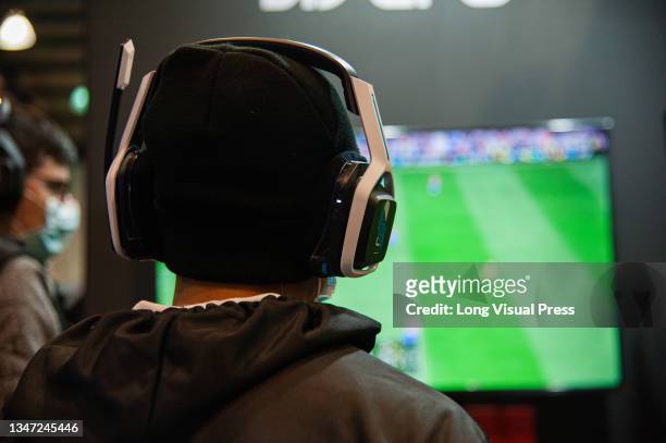 An attendee plays a Soccer game during the fourth day of the SOFA 2021, a fair aimed to the geek audience in Colombia that mixes Cosplay, gaming,...
