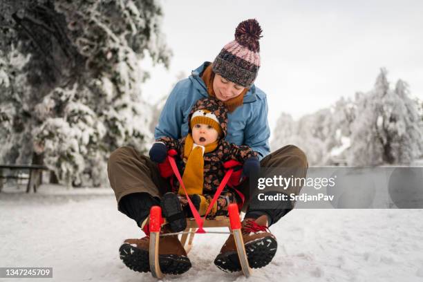 Infant Sleigh Riding 1,212 Baby Sled Stock Photos, High-Res Pictures, and Images - Getty Images