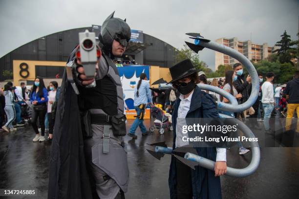 Father and his son cosplay DC character Batman and Marvel's Spiderman enemy Doctor Octopus during the first day of the SOFA 2021, a fair aimed to the...