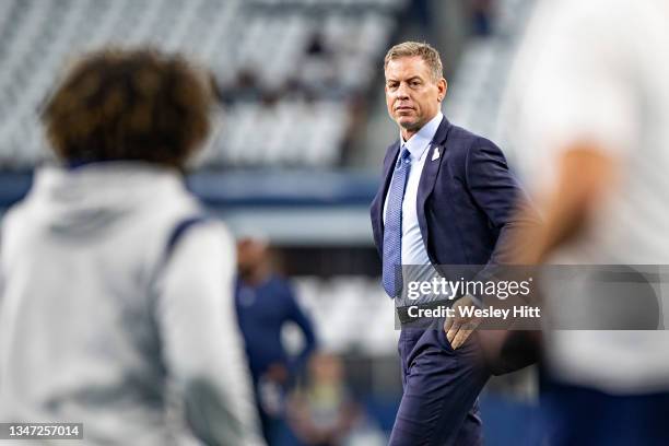 Troy Aikman on the field talking with Ezekiel Elliott of Dallas Cowboys before a game against the New York Giants at AT&T Stadium on October 10, 2021...