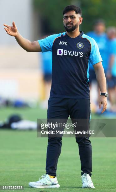 Dhoni, Mentor of India looks on ahead of the India and England warm Up Match prior to the ICC Men's T20 World Cup at on October 18, 2021 in Dubai,...