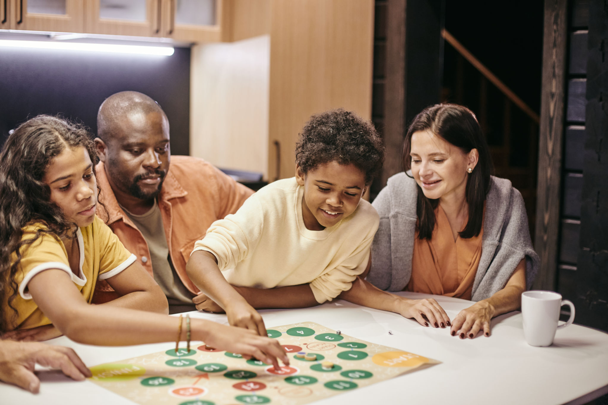 family playing board game